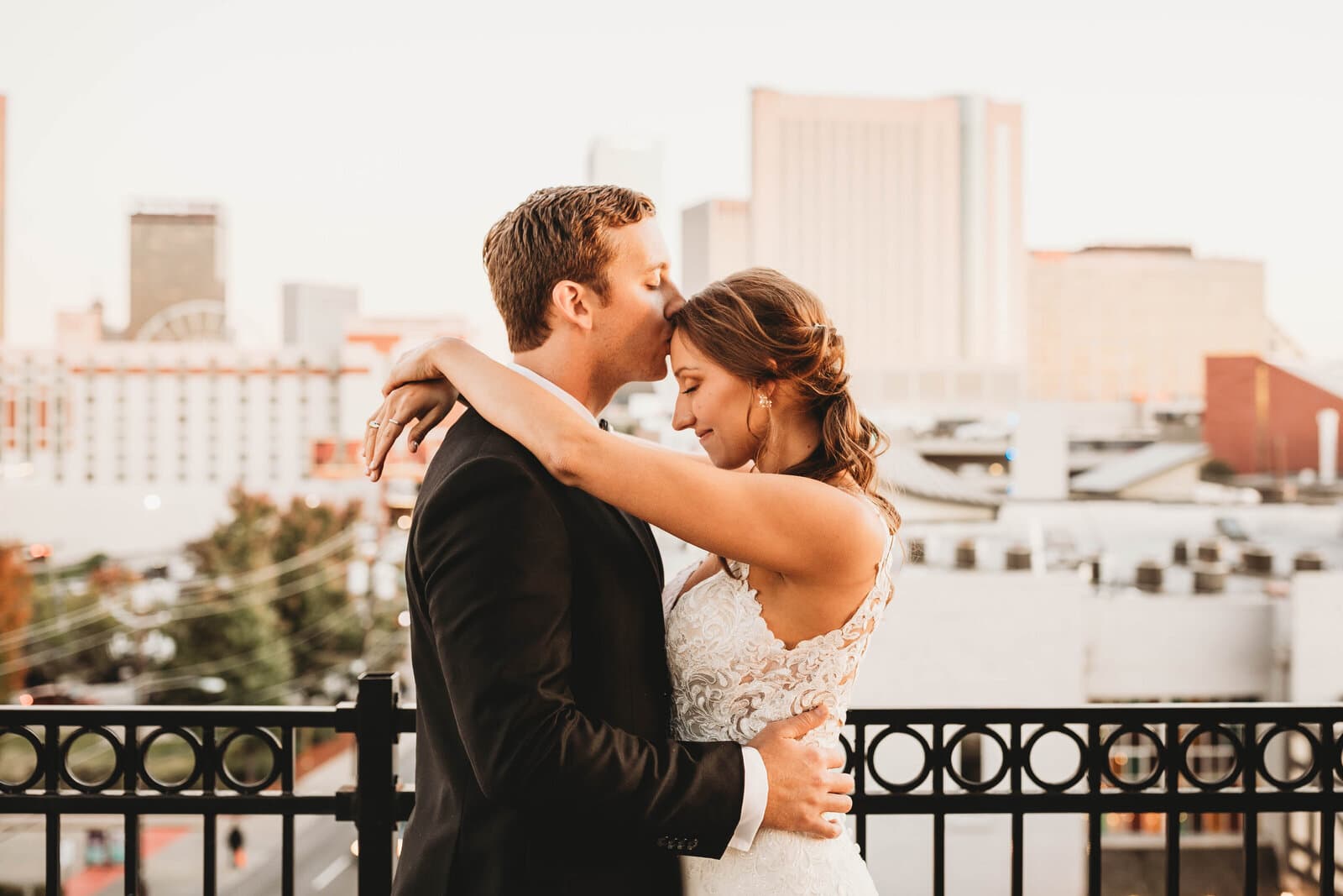Wedding couple kissing with a view of Atlanta