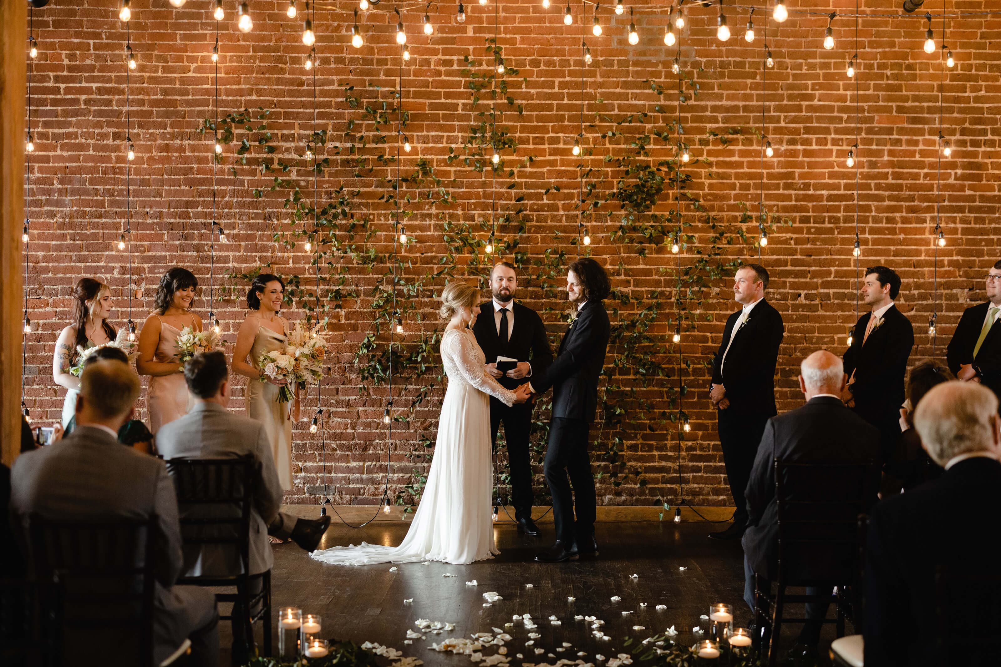 Couple holding hands at wedding altar in Terminus 330